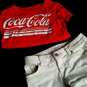 Coca-Cola shirt and White Cat And Jack shorts